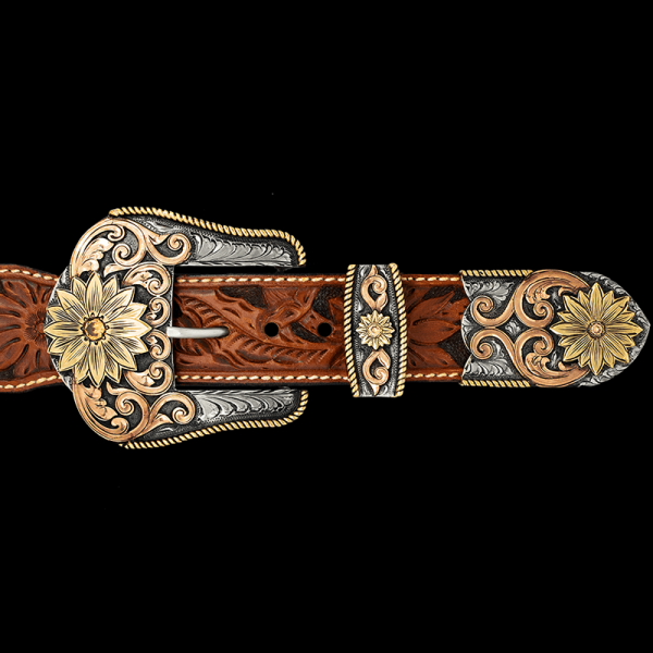 The Florence Three Piece Buckle Set will add a unique and feminine Western Flare to any Cowgirl oufit! Featuring beautiful golden bronze sunflowers on buckle, loop and tip. Order now!